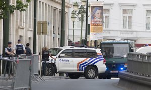 Vans and a police escort arrive for a court hearing for suspect Mohamed Abrini at the Court of Appeals in Brussels on Thursday, June 23, 2016.  A Brussels appeals court panel met Thursday to consider France’s extradition request for Mohamed Abrini, 31, a suspect in the Paris and Brussels attacks that were claimed by the Islamic State organization. (AP Photo/Virginia Mayo)