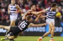 Jack Newnes and Dylan Roberton tackle Steven Motlop of the Cats. 