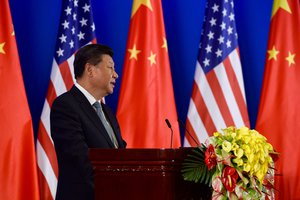 Chinese President Xi Jinping addresses U.S. Secretary of State John Kerry, U.S. Treasury Secretary Jack Lew, Chinese Vice Premier Liu Yandong, Chinese Vice Premier Wang Yang, and Chinese State Councilor Yang Jiechi, and other U.S. and Chinese officials on June 6, 2016, in a villa at the Diaoyutai Guest House complex in Beijing, China, as the Chinese leader opens a two-day Strategic and Economic Dialogue between their respective countries