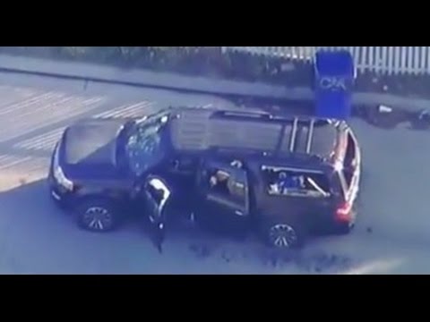 CRAZY FOOTAGE: SHOT UP VEHICLE, BLOOD IN THE STREET IN SAN BERNARDINO CALIFORNIA.