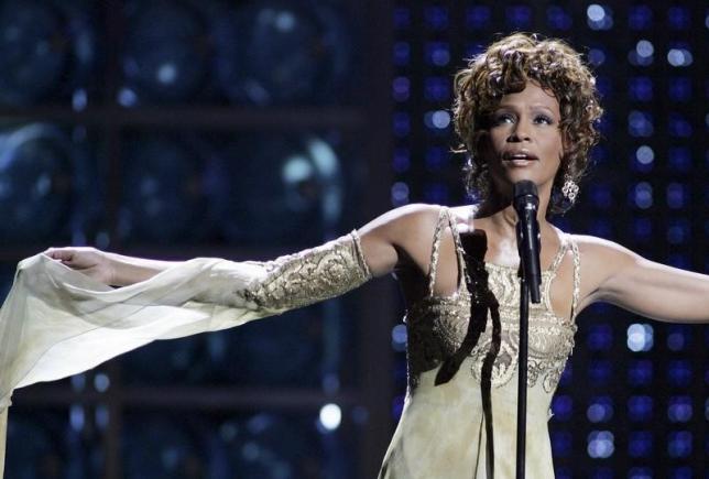 Whitney Houston performs during the World Music Awards at the Thomas & Mack Center in Las Vegas, Nevada as a tribute to music mogul Clive Davis, who received the Outstanding Contribution to the Music Industry Award, in this September 15, 2004 file photo. REUTERS/Ethan Miller/Files