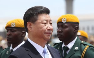 Chinese President Xi Jinping, inspects the guard of honour upon his arrival in Harare, Zimbabwe, Tuesday, Dec. 1. 2015.