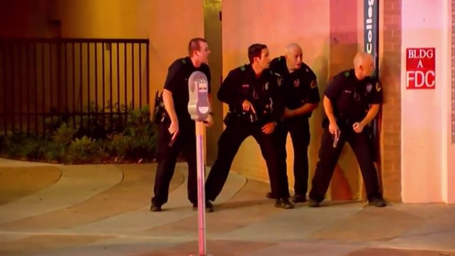 Officers take cover as shots rang out in downtown Dallas