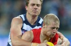 GEELONG, AUSTRALIA - JULY 08: Mitch Duncan of the Cats tackles Zak Jones of the Swans during the round 16 AFL match ...