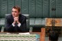 Assistant Minister for Innovation Wyatt Roy in the Prime Minister's chair ahead of Question Time at Parliament House in ...