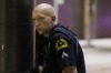A Dallas policeman keeps watch on a street in downtown Dallas,