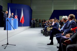 U.S. Secretary of State John Kerry and U.S. Defense Secretary Ash Carter look on as Polish President Andrzej Duda makes remarks on July 8, 2016, at the National Stadium in Warsaw, Poland, during a joint statement with President Obama following a bilateral meeting on the sidelines of the NATO Summit.