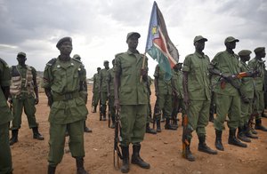 South Sudanese rebel soldiers stand to attention at a military camp in the capital Juba, South Sudan