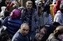 Refugees wait outside a registration office in Berlin.