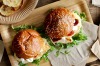 Chicken and cheese burgers with oven crisps.