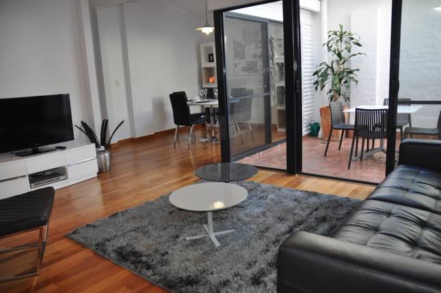 Living room: Pakenham Palace - inner city apartment in Fremantle