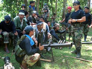 Abu Sayyaf spokesman Abu Sabaya, right foreground, is seen with his band of armed extremists in this undated photo.