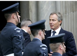 Former British Prime Minister Tony Blair speaks to members of the Royal Air Force, as he arrives at St Paul's Cathedral in London, Friday Oct. 9, 2009, to attend a service of commemoration to mark the end of combat operation in Iraq.