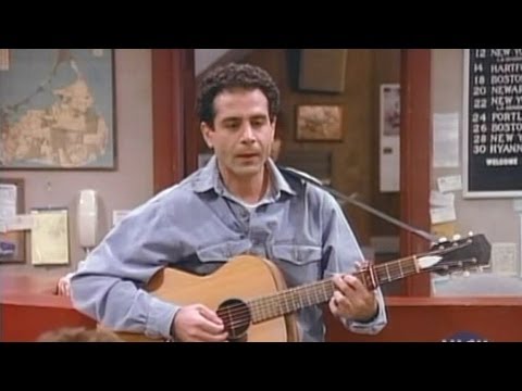 Tony Shalhoub plays guitar and sings in Wings