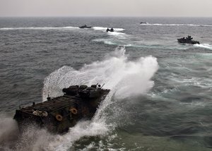 SOUTH CHINA SEA (Jun. 20, 2013) An amphibious assault vehicle exits the well deck of the amphibious dock landing ship USS Tortuga (LSD 46) to conduct an amphibious assault with the Royal Malaysian Navy as a part of Cooperation Afloat Readiness and Training (CARAT) Malaysia 2013.