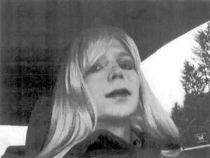 FILE - In this undated file photo provided by the U.S. Army Pfc. Chelsea Manning poses for a photo wearing a wig and lipstick. A U.S. Defense Department official said that Manning, an imprisoned transgender soldier formerly known as Bradley Manning, was hospitlaized Tuesday, July 5, 2016, in Leavenworth, Kan.