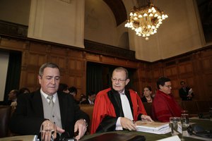 Members of the Nicaraguan legal team, Carlos Jose Arguello Gomez, Alain Pellet, and Paul Reichler, from left, prepare for the hearing at the International Court of Justice in The Hague, Netherlands,