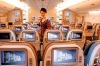 Singapore Airlines flight attendant on A380 economy class.