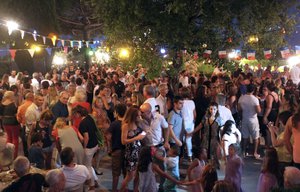 People dance during a party for Bastille Day, at Cremat, near Nice, southeastern France, Monday, July 13, 2015.