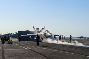 File - An F/A-18C Hornet from the Strike Fighter Squadron 94 prepares to launch from the flight deck of the aircraft carrier USS Carl Vinson conducting the first strike operations supporting Operation Inherent Resolve, including strike operations in Iraq and Syria as directed