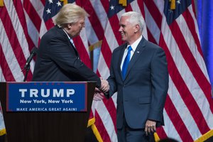 Republican presidential candidate Donald Trump, right, introduces Gov. Mike Pence, R-Ind., during a campaign event to announce Pence as the vice presidential running mate on, Saturday, July 16, 2016, in New York.