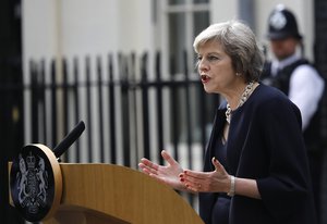 New British Prime Minister Theresa May speaks to the media as she arrives at her official residence,10 Downing Street in London, Wednesday July 13, 2016.