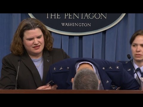 Major general faints during news conference