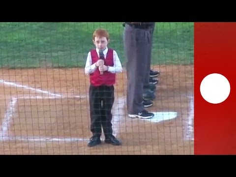 Little boy battles hiccups singing national anthem at baseball game