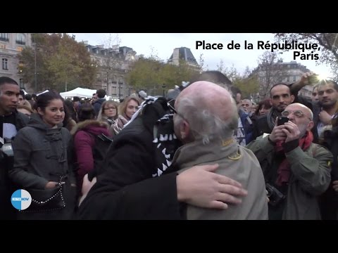 Blindfolded Muslim man with sign “Do you trust me?” hugs hundreds in Paris