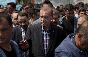 Turkish President Recep Tayyip Erdogan leaves the mosque after attending a funeral for people killed Friday while protesting against the attempted coup against Turkey's government, in Istanbul, Sunday, July 17, 2016. Rather than toppling Turkey's strongman president, a failed military coup appears to have bolstered Erdogan's immediate grip on power and boosted his popularity.