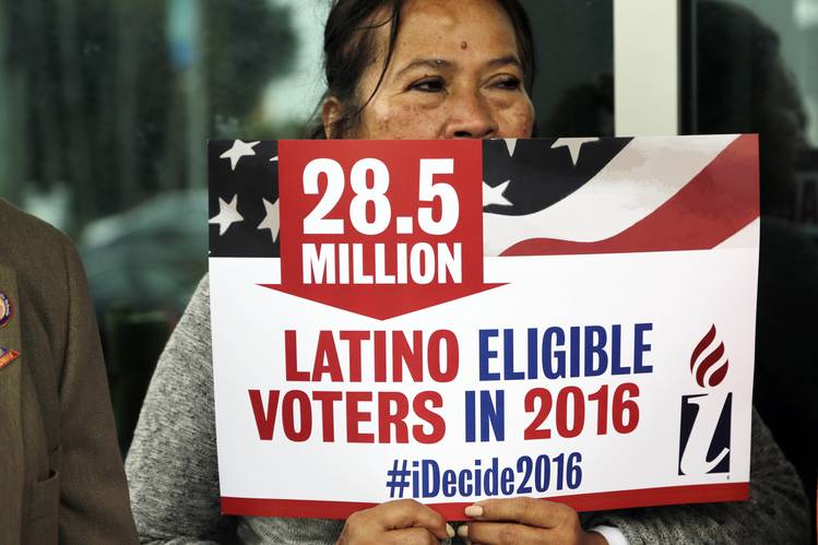 Woman Holds Latino Eligible Voter Sign