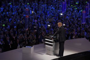 Republican Presidential Candidate Donald Trump steps to the podium to introduce his wife Melania during the opening day of the Republican National Convention in Cleveland, Monday, July 18, 2016.