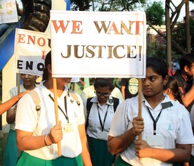 India School Student  Hold the Poster  to Protest against the Yesturday Nun Rape at Ranaghat , in Kolkata on Monday 16 March 2015