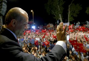 Turkey's President Recep Tayyip Erdogan addresses his supporters gathered in front of his residence in Istanbul, early Tuesday, July 19, 2016.