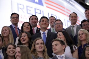 House Speaker Paul Ryan of Wis., center, pose for a group picture on the stage before the second day session of the Republican National Convention in Cleveland, Tuesday, July 19, 2016.