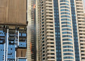 A fire burns at the Sulafa Tower skyscraper in Dubai, United Arab Emirates on July 20, 2016