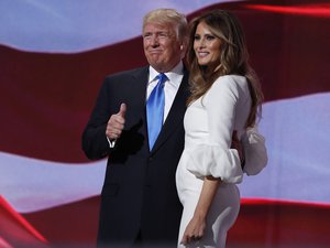 Republican presidential candidate Donald Trump, right, stands with his wife Melania on stage after introducing her during the Republican National Convention, Monday, July 18, 2016, in Cleveland.