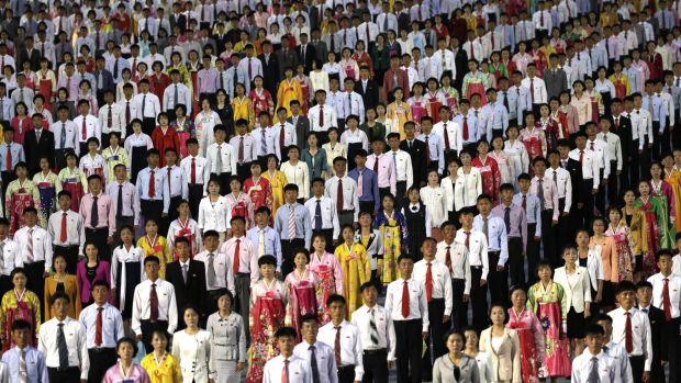 North Korean youths participate in a mass dance party on the Kim Il Sung Square on Tuesday, May 10, 2016, in Pyongyang, North Korea. Hundreds of thousands of North Koreans celebrated the country's newly completed ruling-party congress Tuesday with a massive civilian parade featuring floats bearing patriotic slogans and marchers with flags and pompoms, and celebrations followed on into the evening with a torchlight parade and mass dance party by youths. (AP Photo/Wong Maye-E)