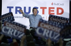 Republican presidential candidate, Sen. Ted Cruz, R-Texas, waves to supporters as he arrives at Iowa State Fairgrounds, Sunday, Jan. 31, 2016, in Des Moines, Iowa.