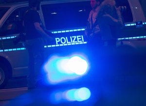 Policemen block the scene of the shooting with a large section of the surrounding area in Munich, Germany, Saturday, July 23, 2016. A man found dead near a Munich shopping center killed himself and was likely the lone gunman in an attack that killed nine people and injured at least 10 others, a spokesman for the Munich police said. (AP Photo/Jens Meyer)