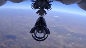 In this photo made from the footage taken from Russian Defense Ministry official web site on Monday, Oct. 5, 2015 a bomb is released from Russian Su-24M jet fighter in Syria. NATO strongly criticized the Russian air campaign in Syria that began Wednesday.