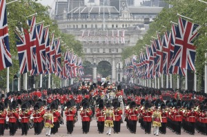 The Queen rides in a carriage along the Mall during the Trooping The Colour parade at Buckingham Palace in June 2016. ...