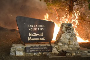 A maker at the entrance of the Angeles National Forest burns on Saturday, July 23, 2016. Hundreds of county and Angeles National Forest firefighters battled the blaze, aided by three dozen water-dropping helicopters and retardant-dropping airplanes.