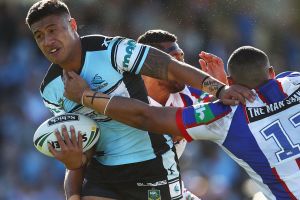 On the move: Fa'amanu Brown busts through the Knights defence.