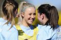 Belconnen United players celebrate winning the women's title last year.