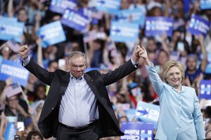 Democratic presidential candidate Hillary Clinton and Sen. Tim Kaine, D-Va., arrive at a campaign rally at Florida International University Panther Arena in Miami, Saturday, July 23, 2016.