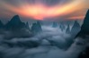 This was taken at the break of dawn on a mountain top in Guilin, China. On a fine day, one can see the city that ...