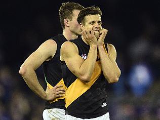 Brett Deledio (right) of the Tigers is seen after the Round 16 AFL match between the Western Bulldogs and the Richmond Tigers at Etihad Stadium in Melbourne, Saturday, July 9, 2016. (AAP Image/Julian Smith) NO ARCHIVING, EDITORIAL USE ONLY