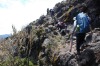 Scrambling up a cliff wall up Kilimanjaro, two teams head up on September 22, 2014 in a bid to play worlds highest game ...