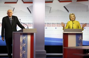 Democratic presidential candidate, Hillary Clinton makes a point as Sen. Bernie Sanders, I-Vt, reatcs during a Democratic presidential primary debate at the University of Wisconsin-Milwaukee, Thursday, Feb. 11, 2016, in Milwaukee. (AP Photo/Morry Gash)